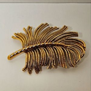 Vintage Monet goldtone feather brooch.